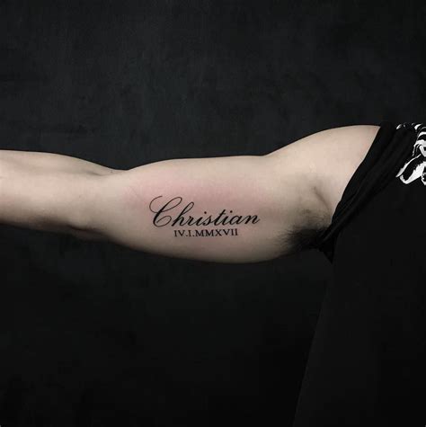 inner bicep name tattoo